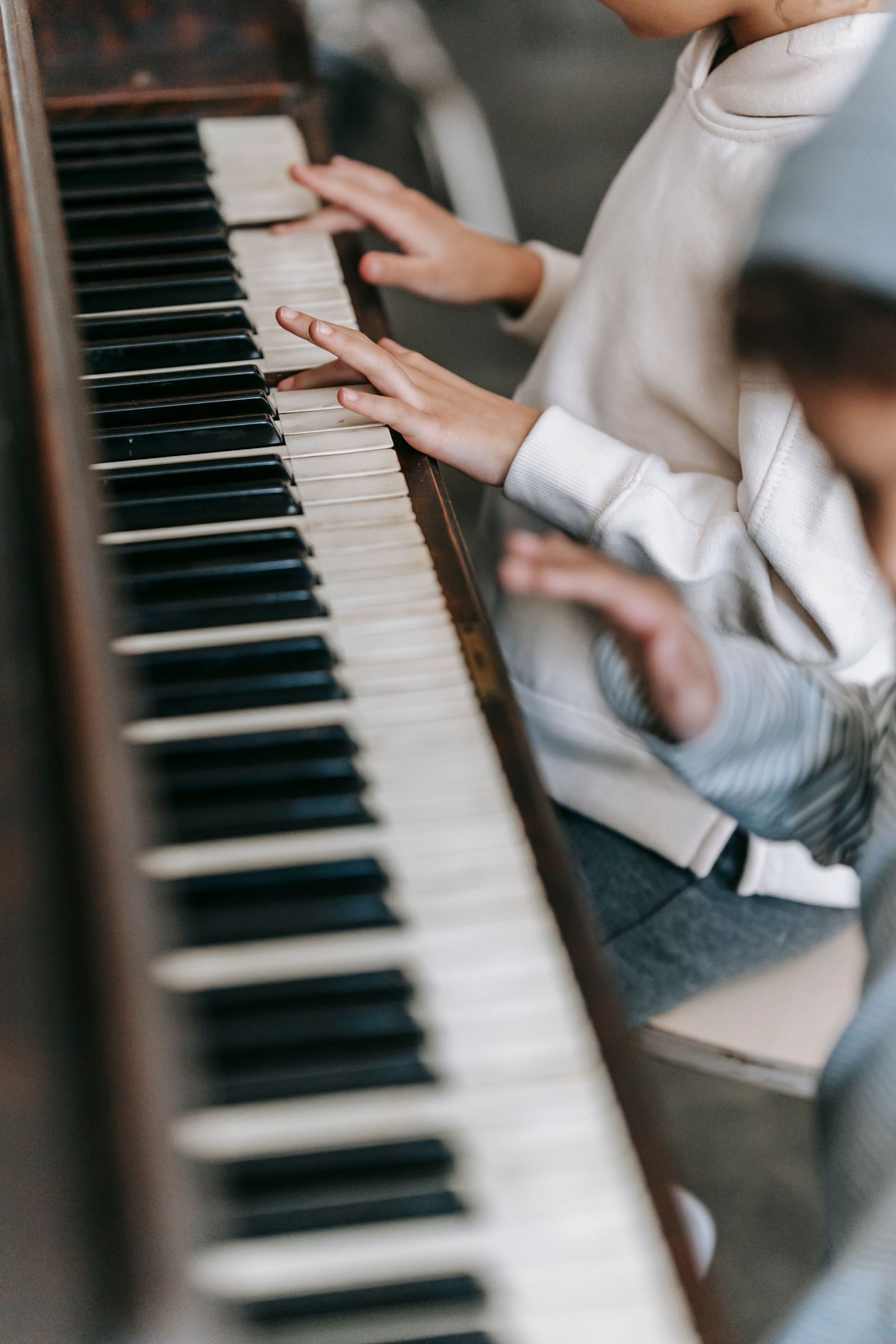 Young student playing piano
